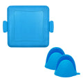 Red silicone baking tray with a pair of matching oven gloves on a kitchen counter