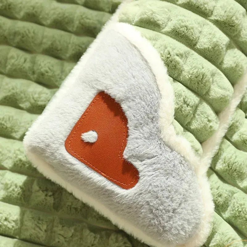 Large grey dog bed mat with removable cover shown next to a sleeping dog, demonstrating its size.