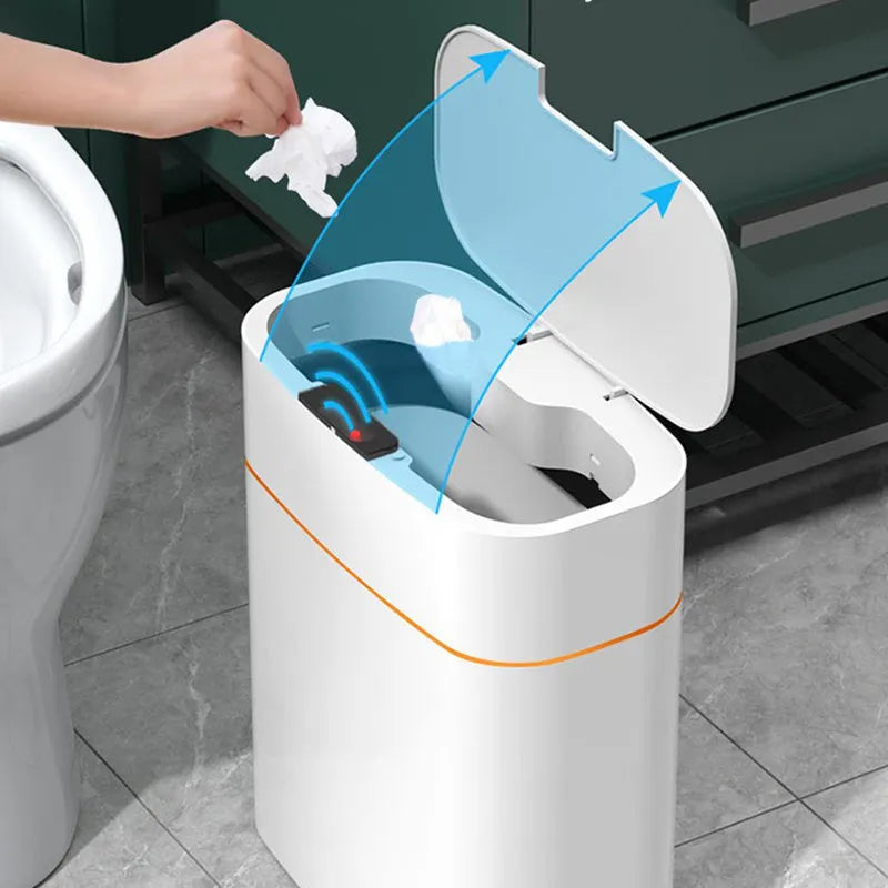 White induction smart trash can with automatic lid on a kitchen floor.