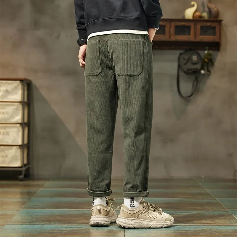 Corduroy men's casual trousers in street fashion style with straight leg opening and tapered cut