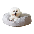 Fluffy pet bed in beige with raised rim on a light wood floor, available in sizes 60 to 80 cm diameter