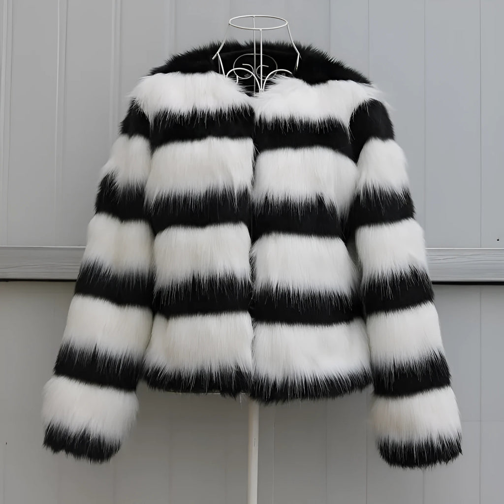 Black and white striped faux fur leather jacket for women, shown in a street fashion style.