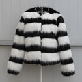 Black and white striped faux fur leather jacket for women, shown in a street fashion style.