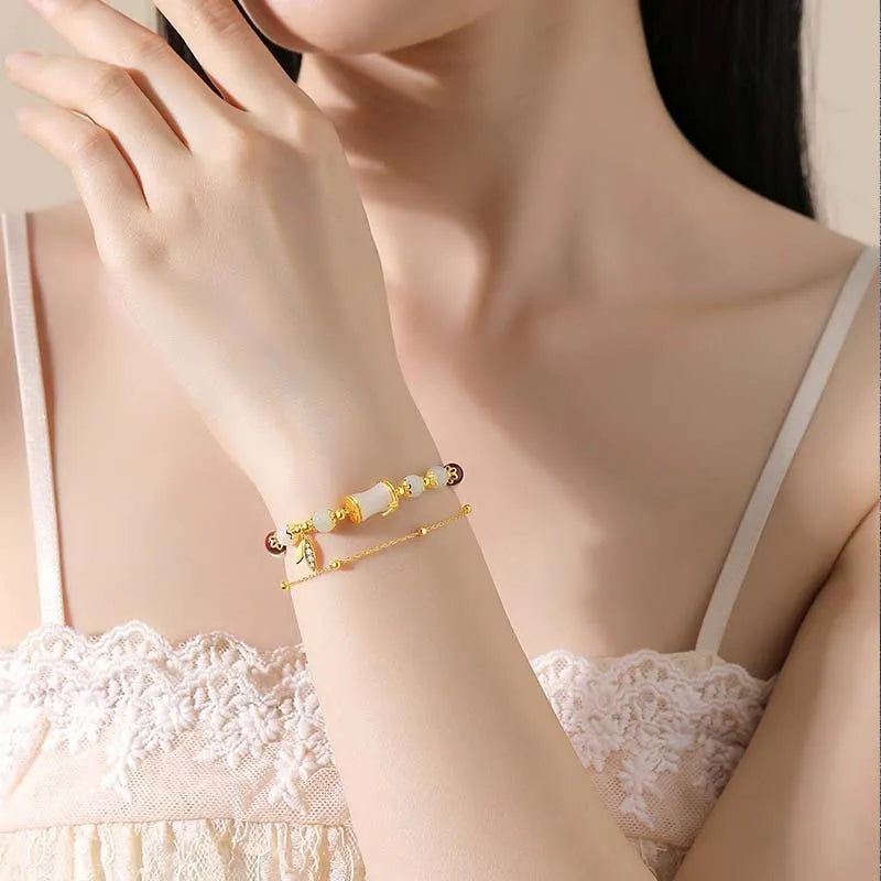 Retro glass flower bracelet with ruyi design in electroplated finish showing beige, green, light green, and white colour options