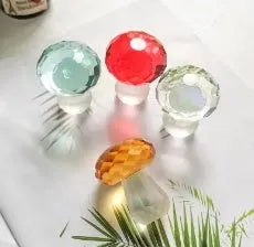 Colourful crystal mushroom decorative ornament in modern geometric style on a plain background.