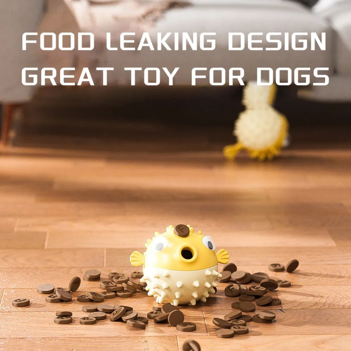 Yellow vinyl fish-shaped squeaky dog chew toy on a plain background