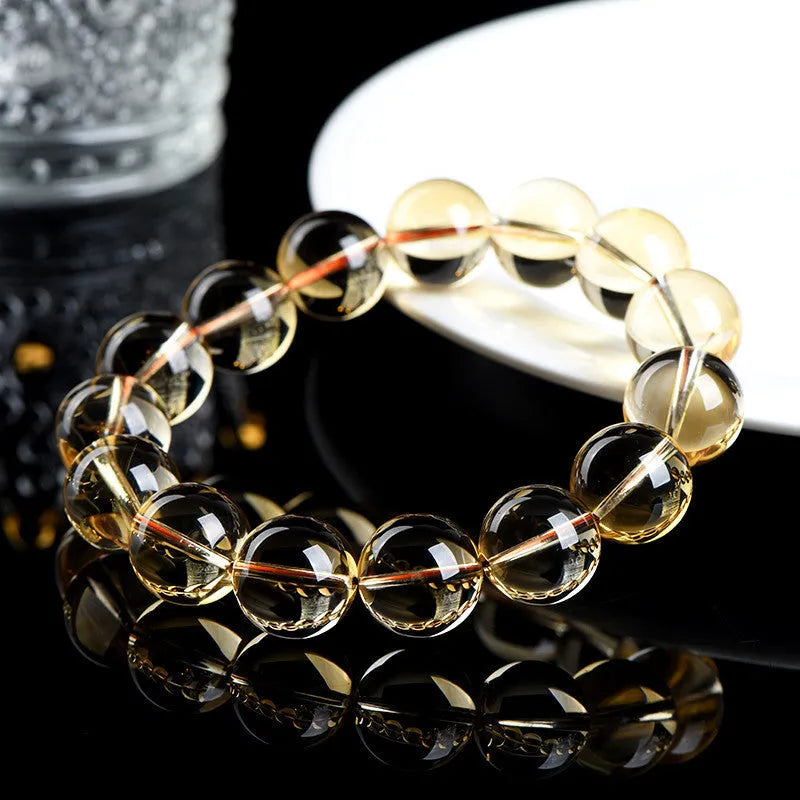Natural citrine scattered beads ball bracelet showing polished beads in 7A and 6A colour grades.