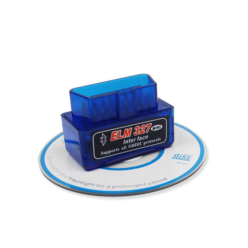 Small black ELM327 OBD2 Bluetooth car diagnostic scanner plugged into a vehicle port.
