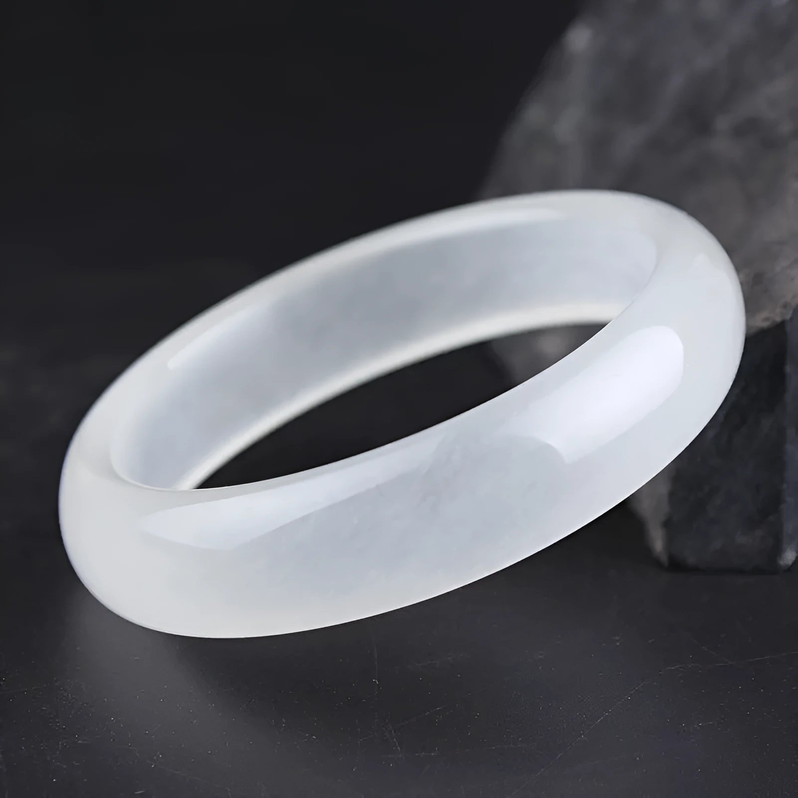 Gao Bing jade bracelet in white moonlight colour on a wrist, showing flat and round bar shape options.