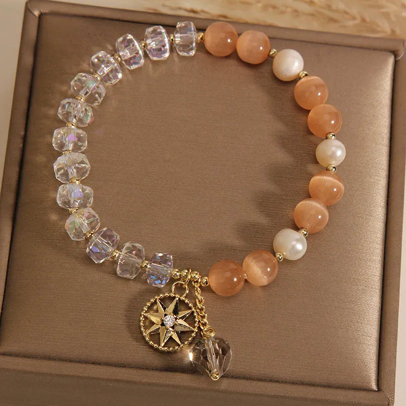 Orange women's bracelet with eight Awn star design and gold-plated inlaid stone.