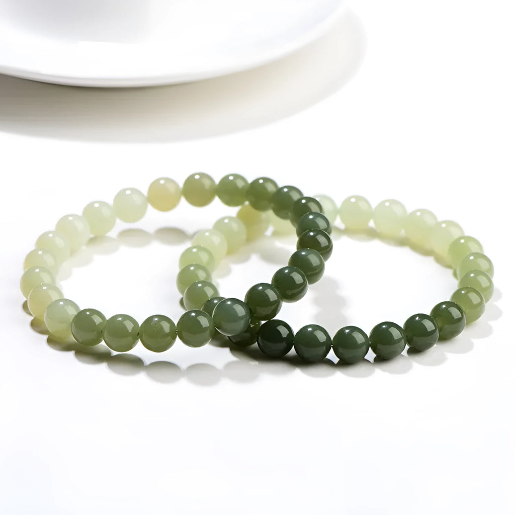 Natural clear water Hetian jade bracelet with gradient colour beads in round or barrel styles.