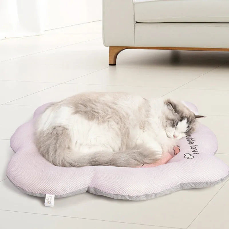 Ice silk pet cooling mat in green or pink colour, shown in four different sizes for small to large pets