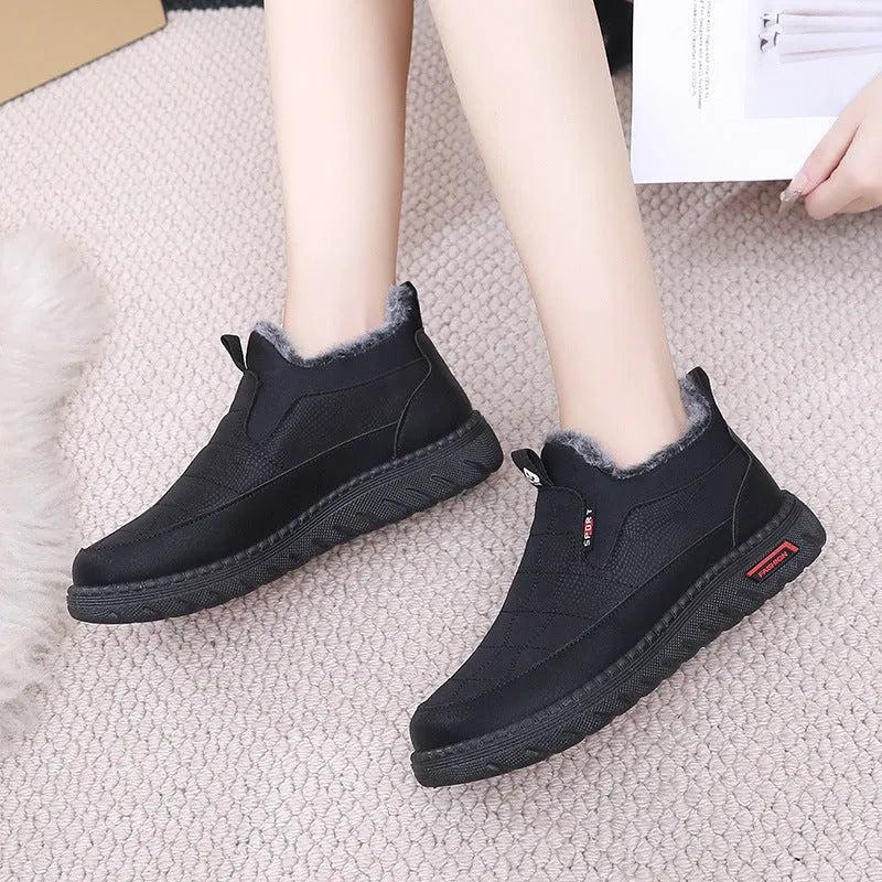 Women's black casual flat ankle boots with round toe and low shaft on a white background.