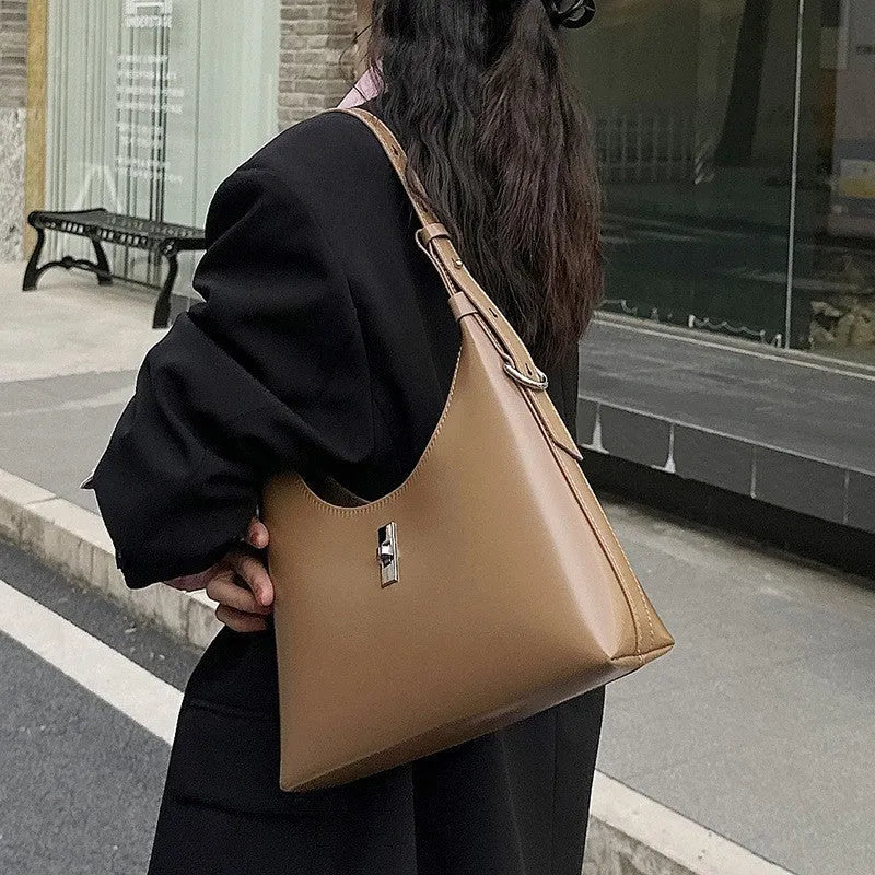 Genuine cowhide leather crossbody shoulder bag in dumpling shape with sandwich pocket and six colour options