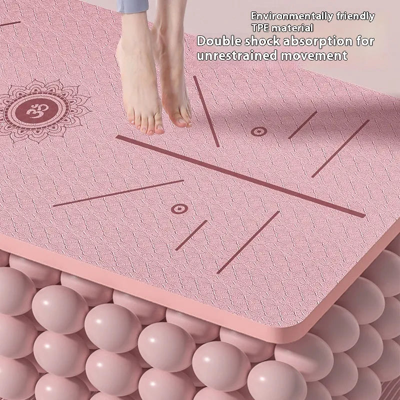 Monet pink TPE fitness mat with printed guide lines, shown rolled and unrolled on a floor.