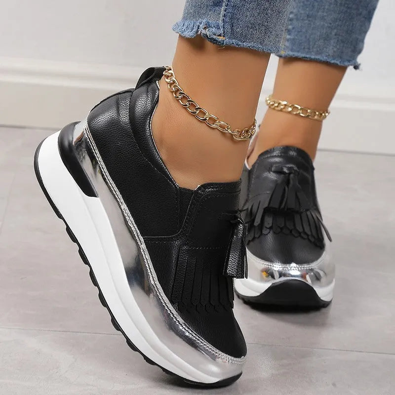 Women's black casual platform shoes with tassel detail and wedge heel