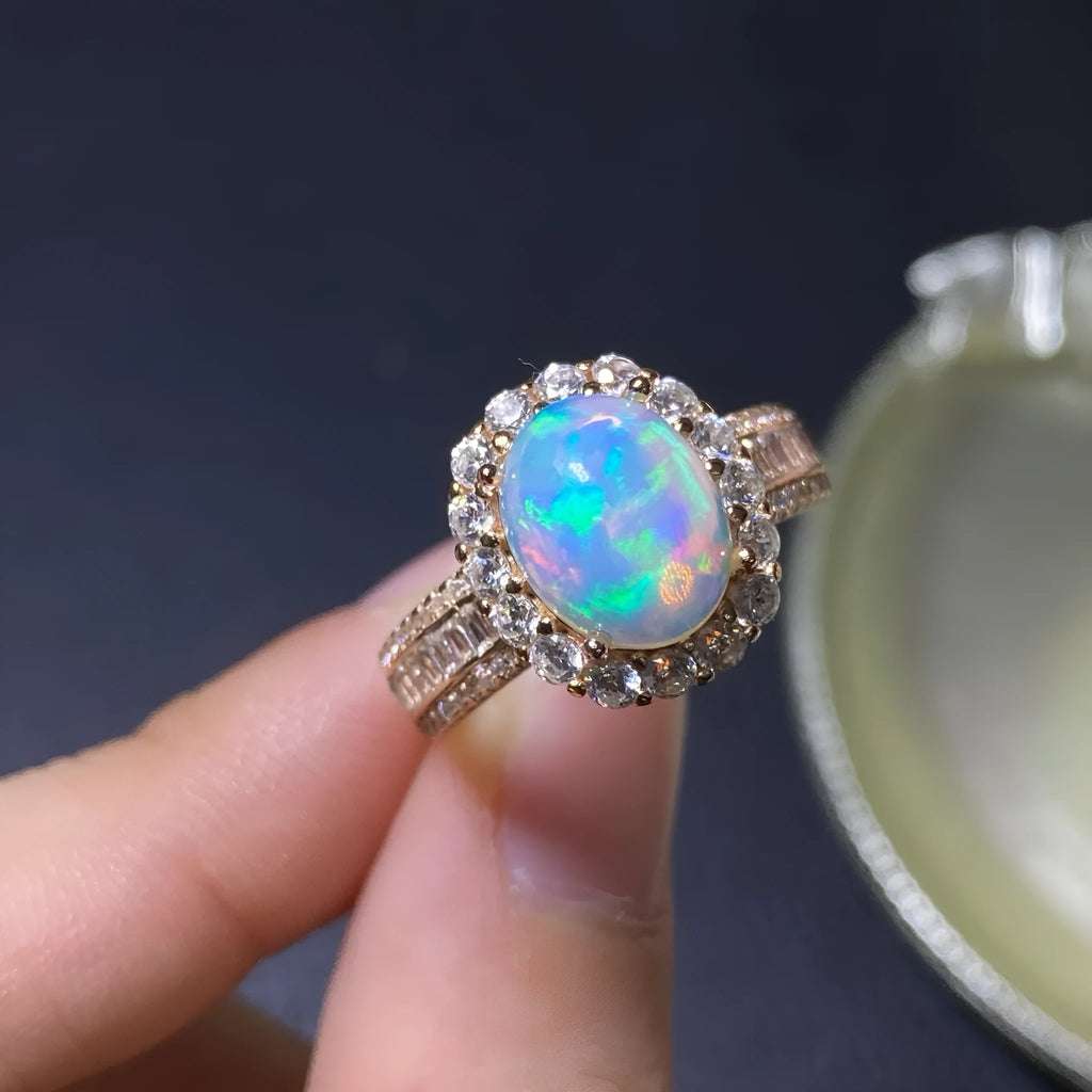 Handmade sterling silver adjustable opal ring showing rose gold, white gold, and yellow gold plated finish options.