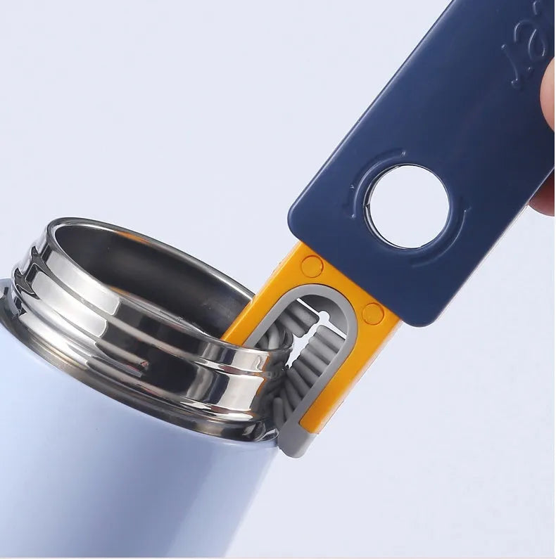 Blue and grey 4-in-1 bottle gap cleaner brush with U-shaped silicone head and multiple cleaning attachments