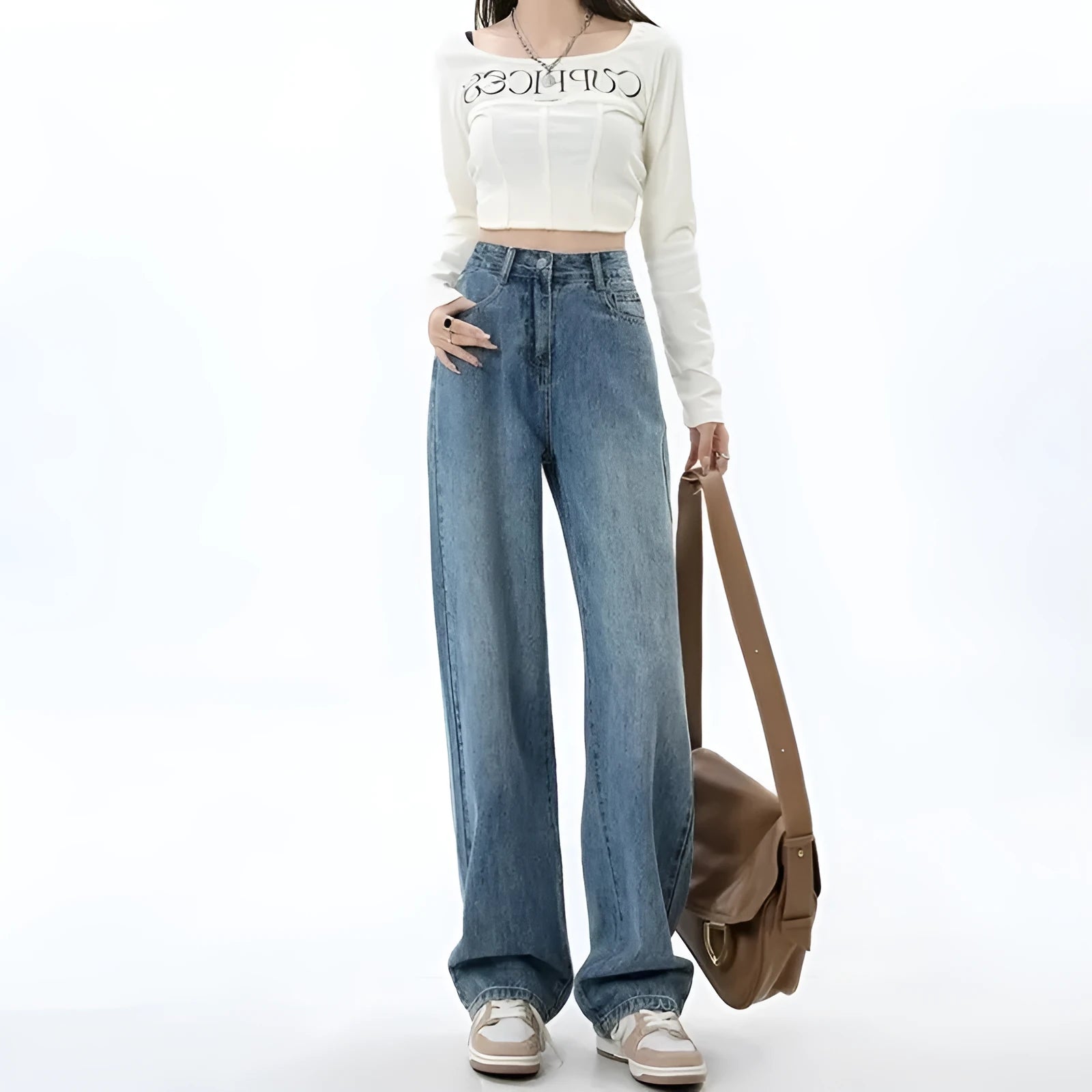 Woman wearing high-waisted retro blue wide leg jeans with a straight-leg cut.