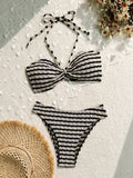 Women's striped bikini swimsuit in polyester fabric available in pink or black