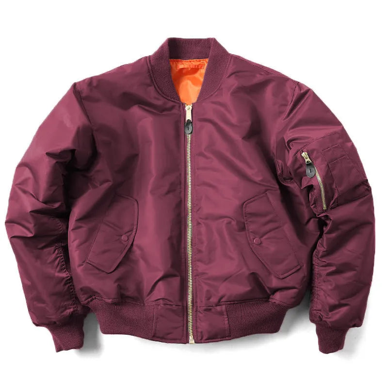 Men's reversible nylon pilot jacket in army green, shown on a model, displaying its loose fit and double-sided design.