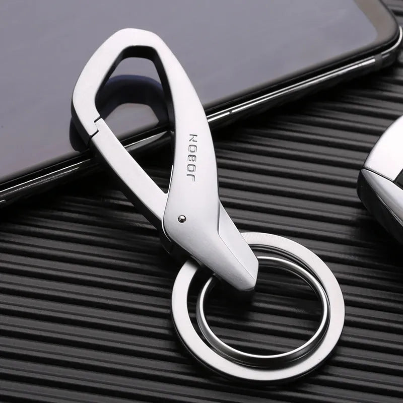 Simple metal double-ring key chain in black, chrome, or nickel finish on a waistband.