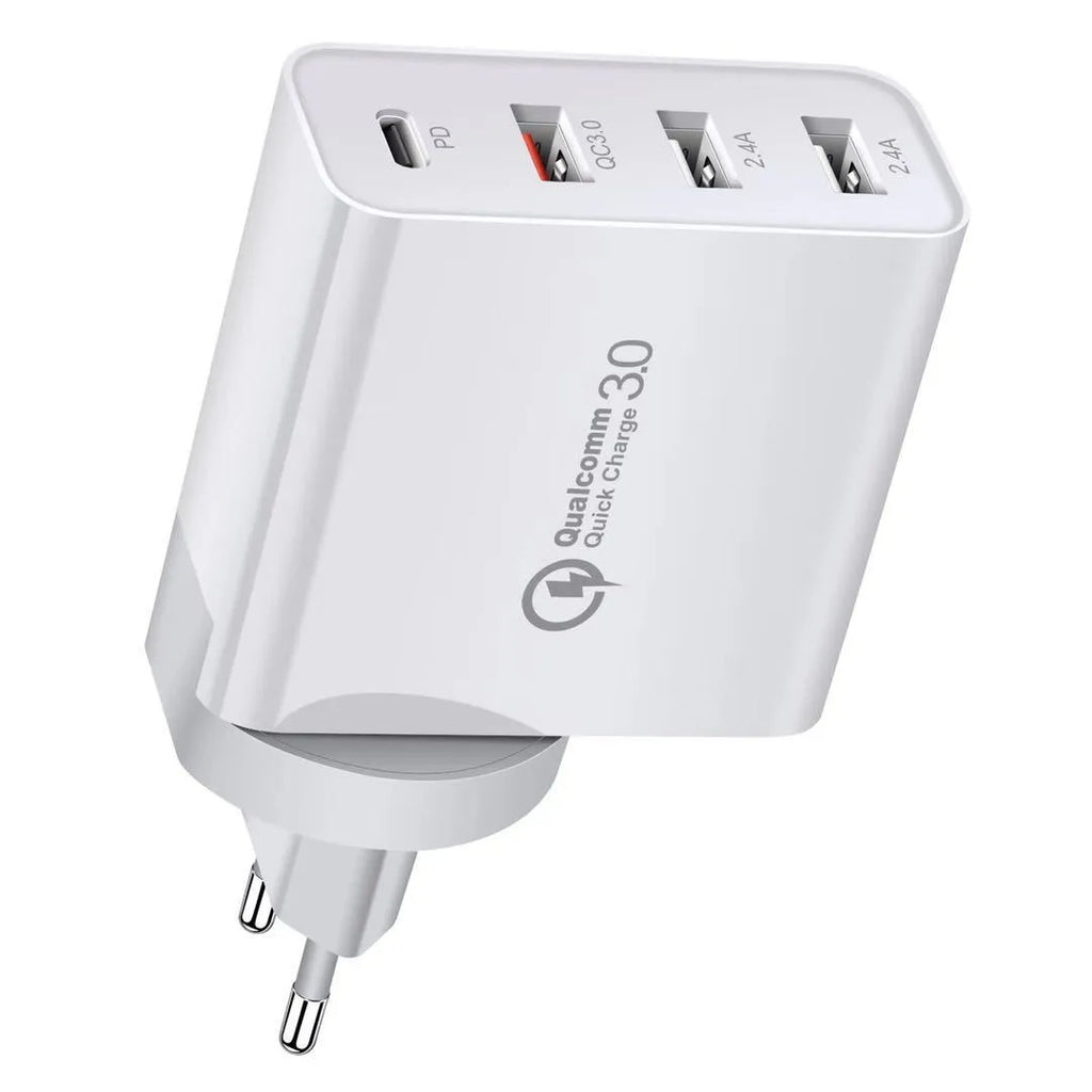 White multi-port fast charge wall charger with international plug options on a desk