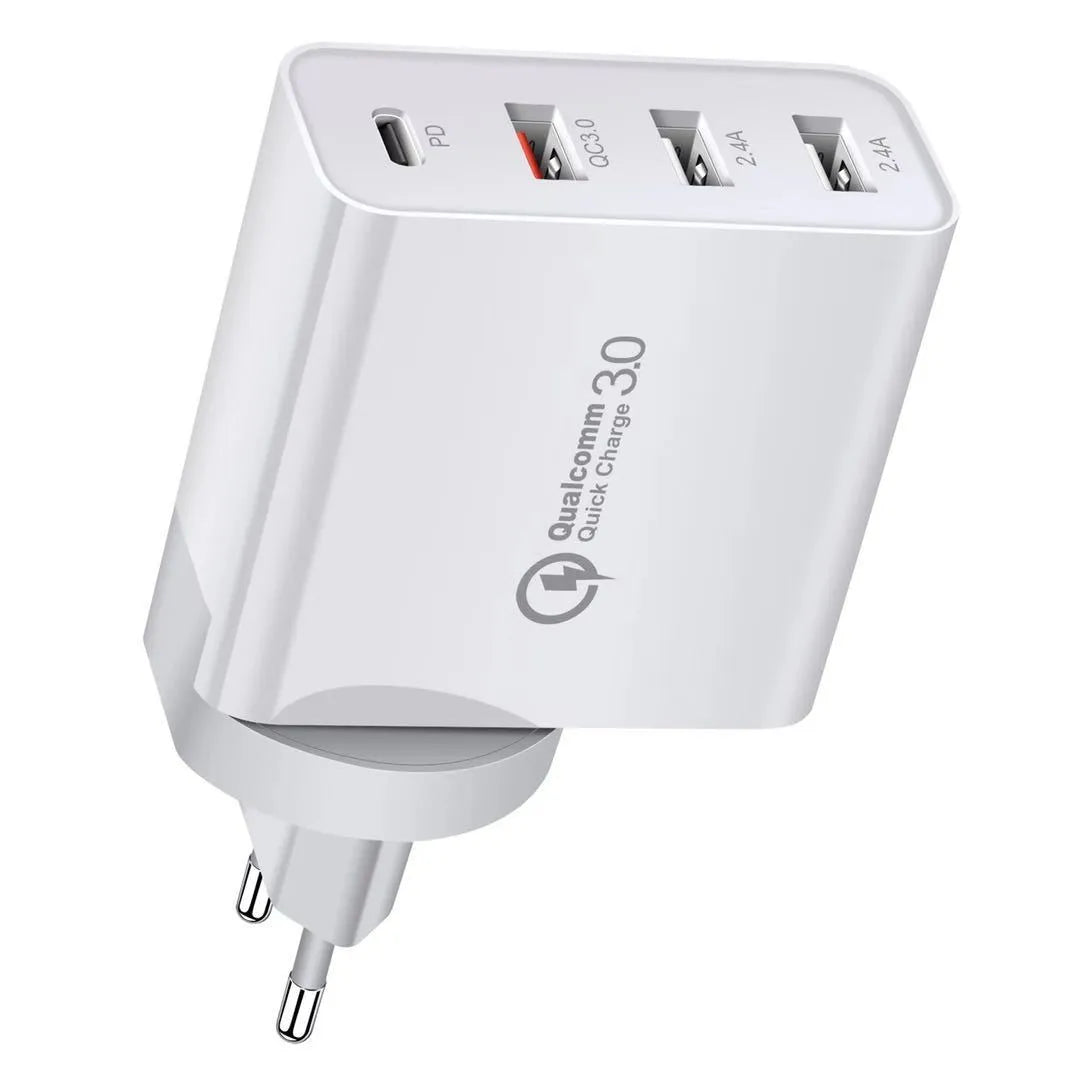 White multi-port fast charge wall charger with international plug options on a desk