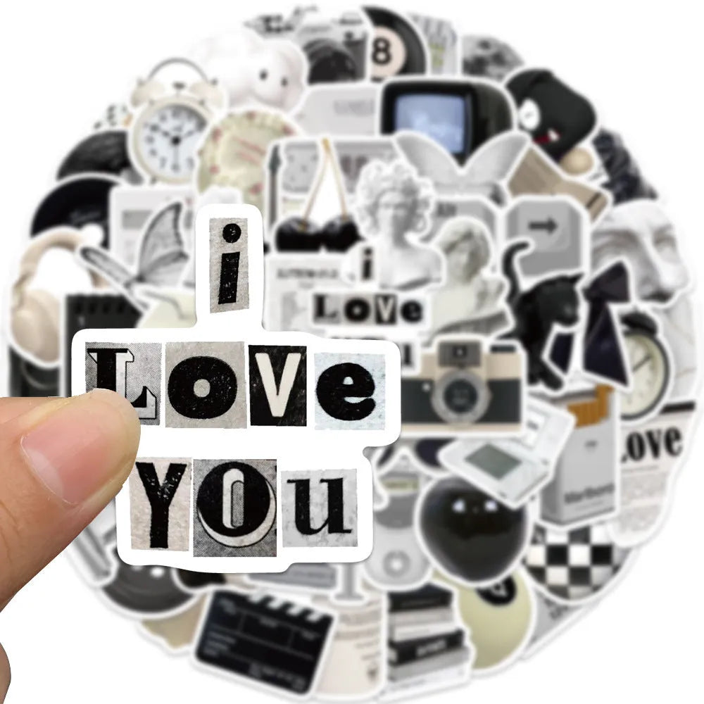 Assortment of 61 black and white line-art PVC stickers for laptops and luggage.