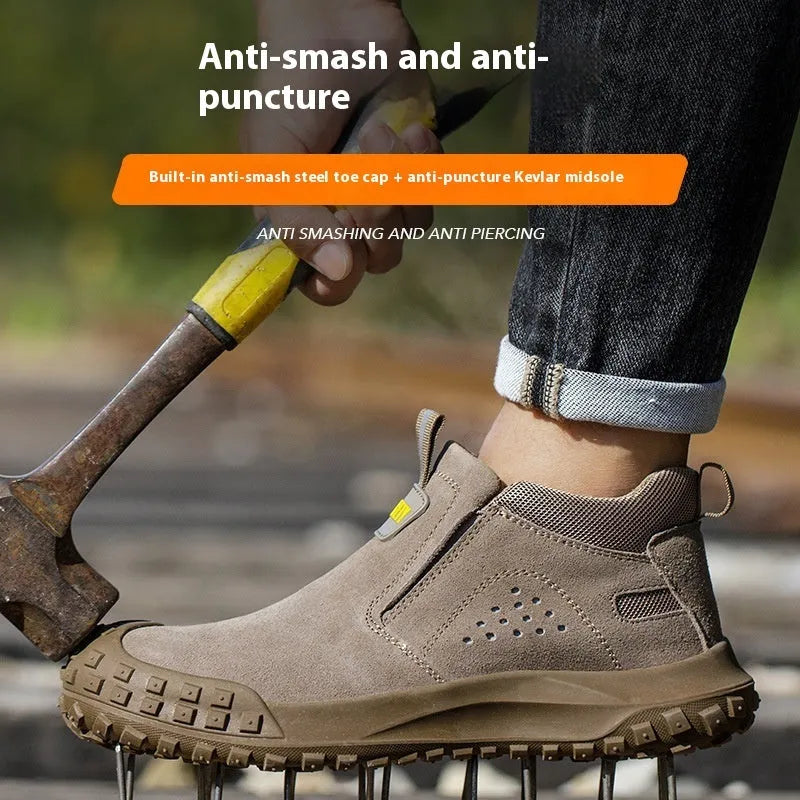 Mid-calf grey steel-toe safety work boots for welding and construction on a industrial floor.