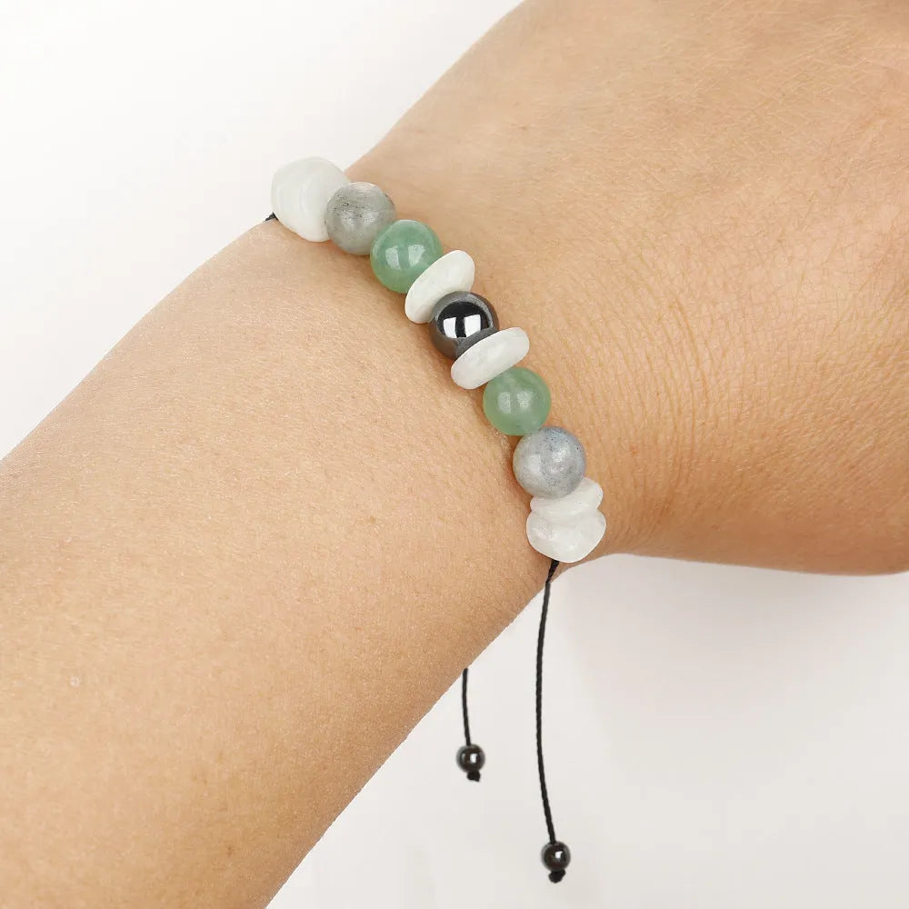 Women's geometric stone bead bracelet with colourful beads in geometric pattern on wrist
