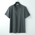 Women's loose-fit apricot-coloured cotton v-neck short sleeve summer top laid flat.