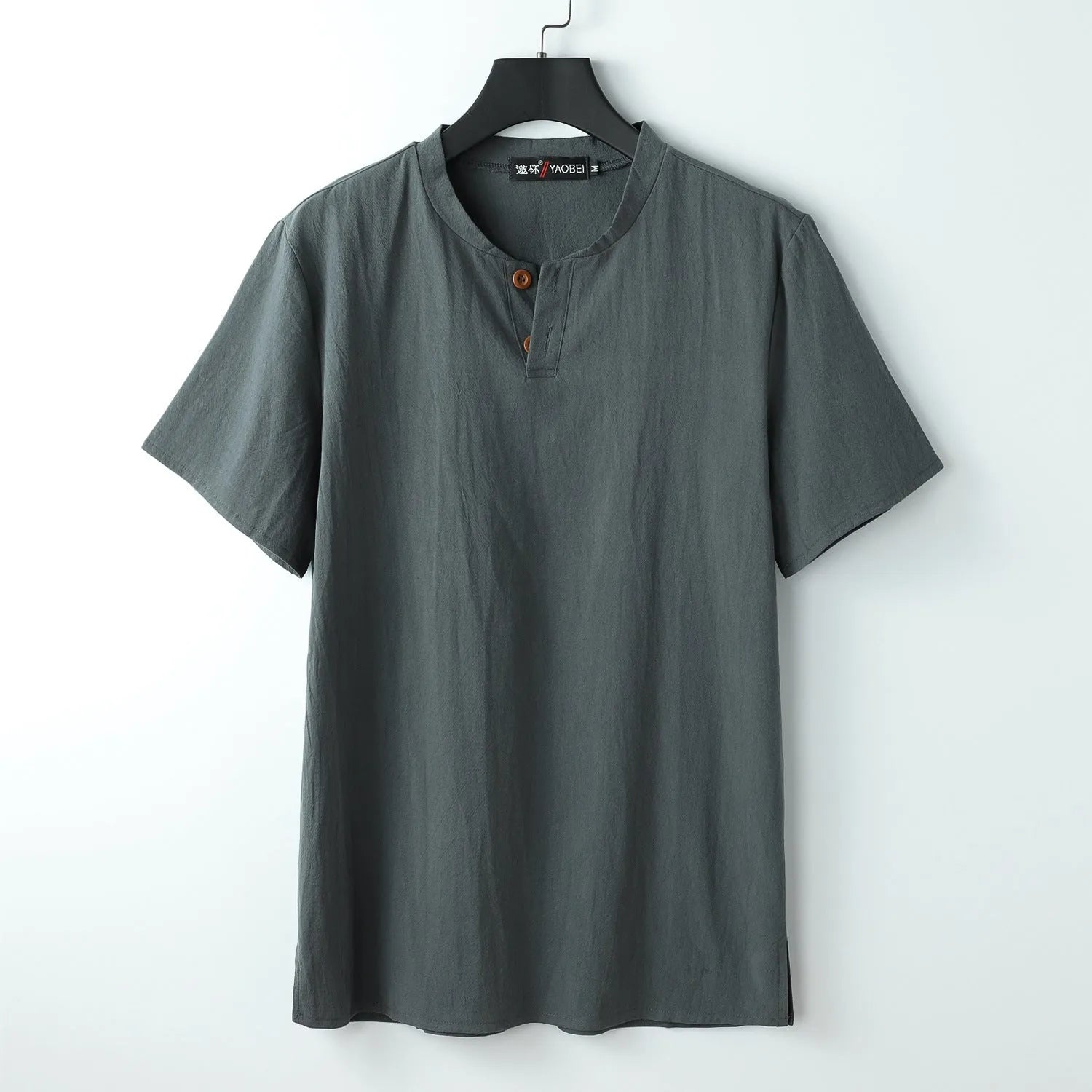 Women's loose-fit apricot-coloured cotton v-neck short sleeve summer top laid flat.