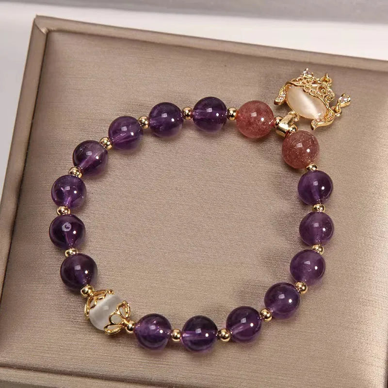 Handmade copper bracelet with natural amethyst crystal and gold longevity lock charm