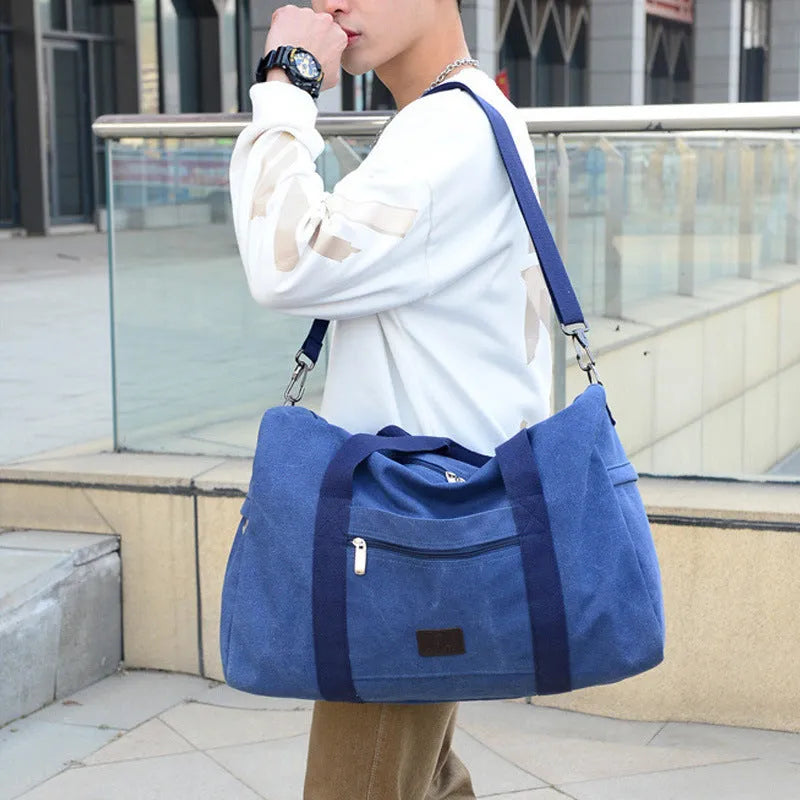 Men's canvas travel duffel bag in army green with three straps and polyester material