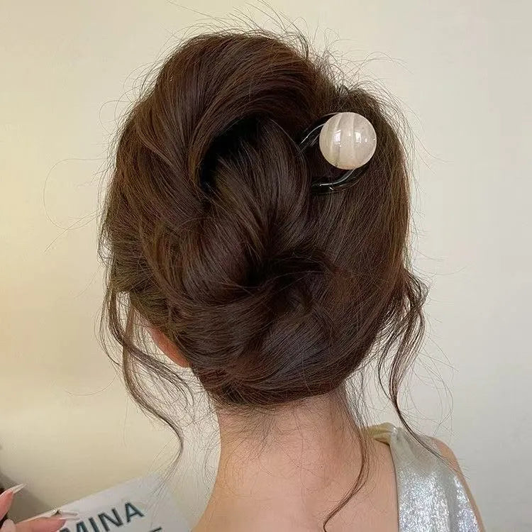U-shaped hair barrettes with ball decoration in beige, caramel, dark gray and green colour options