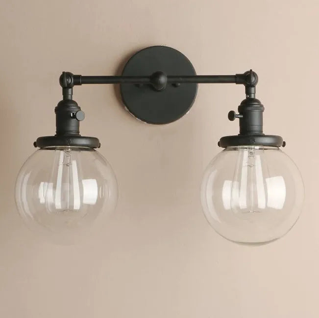 Double headed industrial wall lamp with spherical glass shades, iron black finish, 15x12x24cm