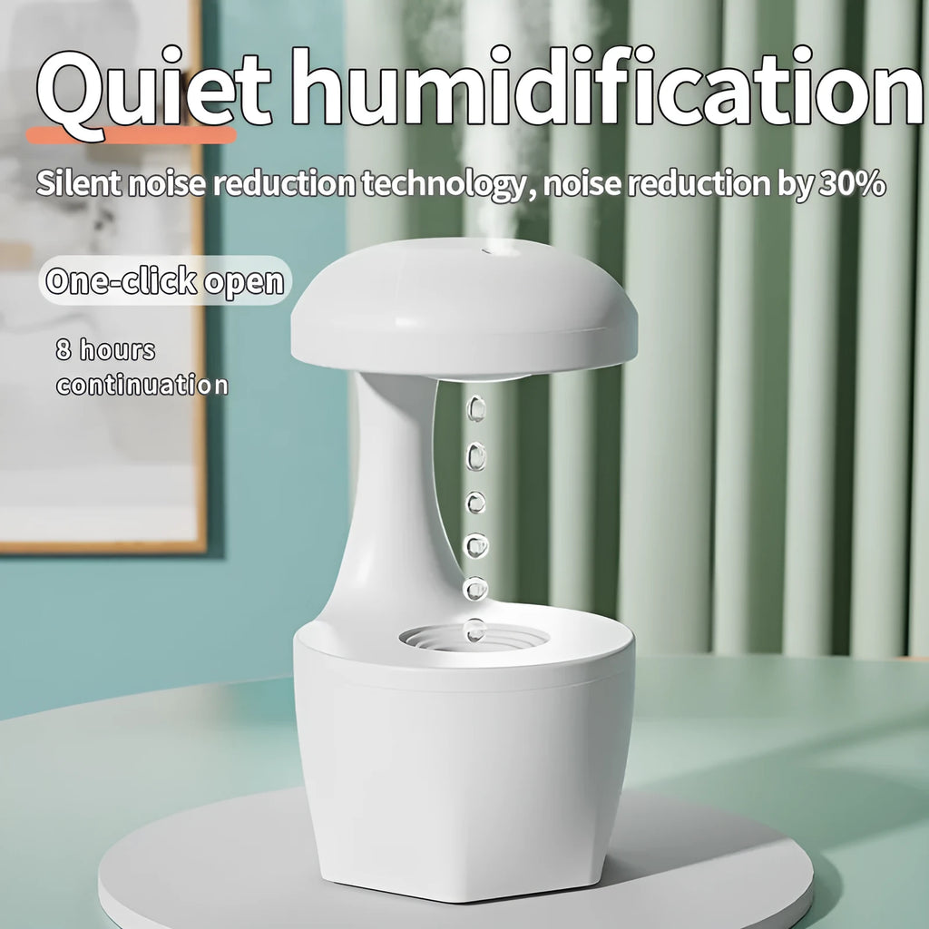 Portable white anti gravity USB cool mist humidifier with 800ml tank and droplet effect on a desk