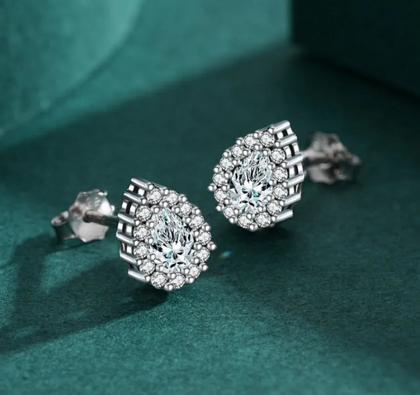 A pair of women's silver drop ear studs with a diamond-cut sparkling finish.