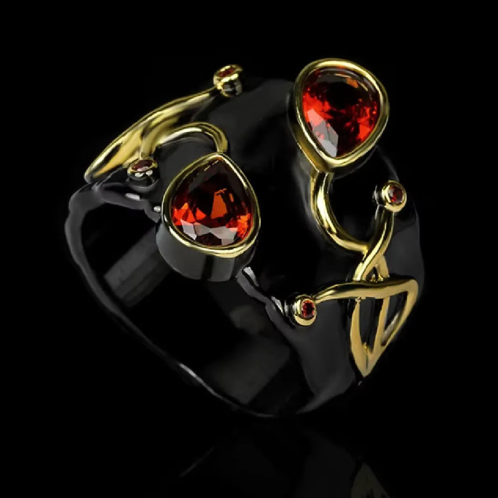 Retro women's straight-pull oval ring in brass with black finish, side view on light background