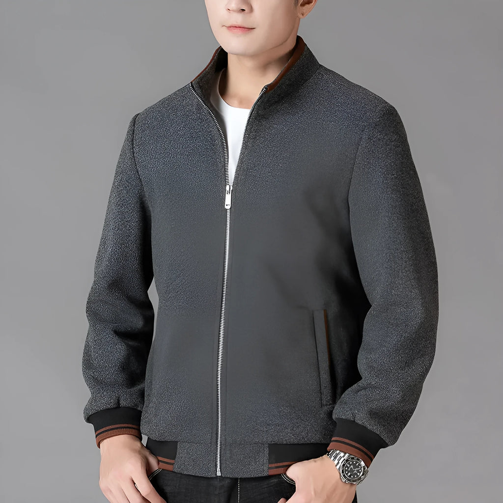 Men's grey sport fleece jacket with long sleeves and a stick pocket, shown on a hanger.