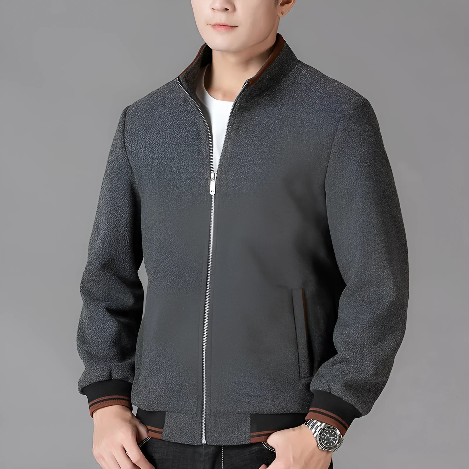 Men's grey sport fleece jacket with long sleeves and a stick pocket, shown on a hanger.