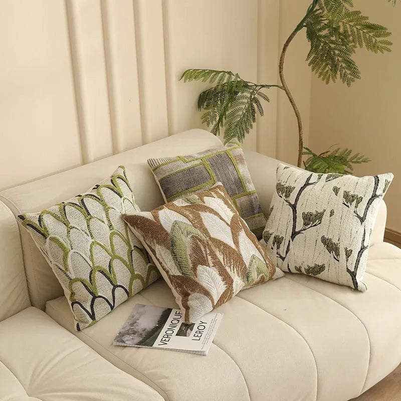 45cm square jacquard cushion cover with detailed floral pattern in retro Nordic style, shown in one of eight available colours.