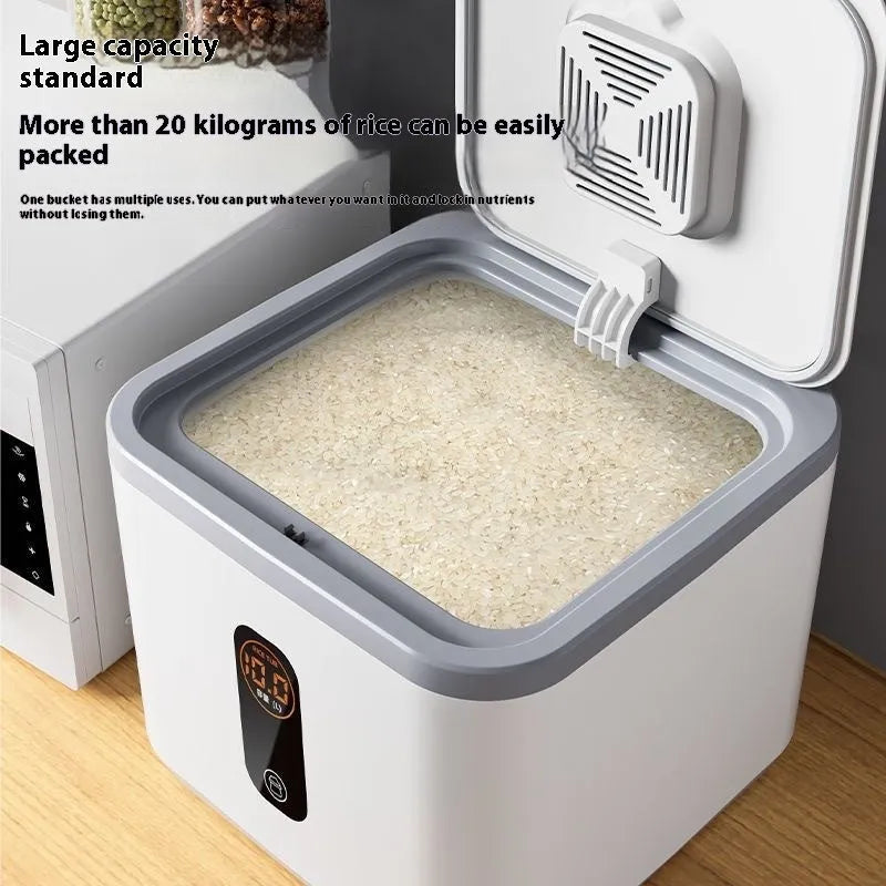 Simple grey plastic rice storage jar with lid and measuring cup for sealed, insect-proof food storage.