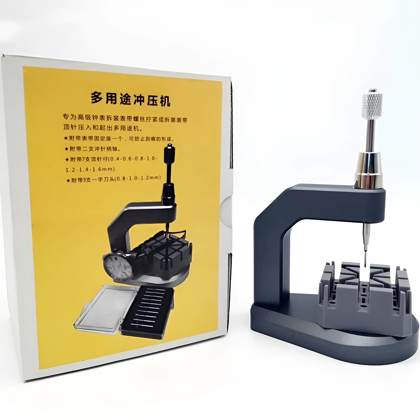 Silver tool steel multi-purpose press strap removal tool on a work surface.