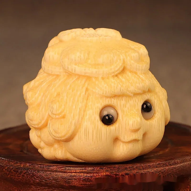 Solid bamboo carving of a cute golden toad Princess ornament for home display.