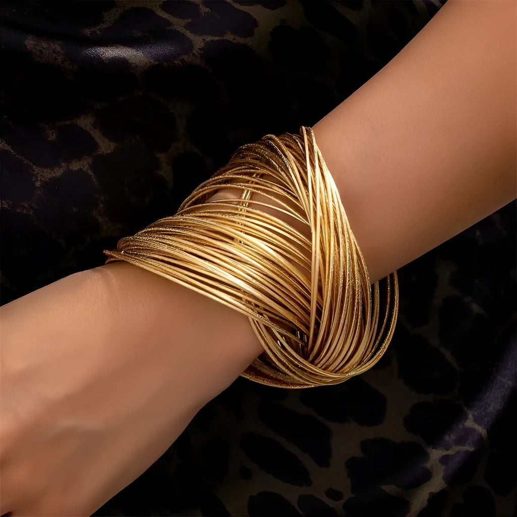 Wide-brimmed irregular zinc alloy bracelet with spring open design and electroplated finish