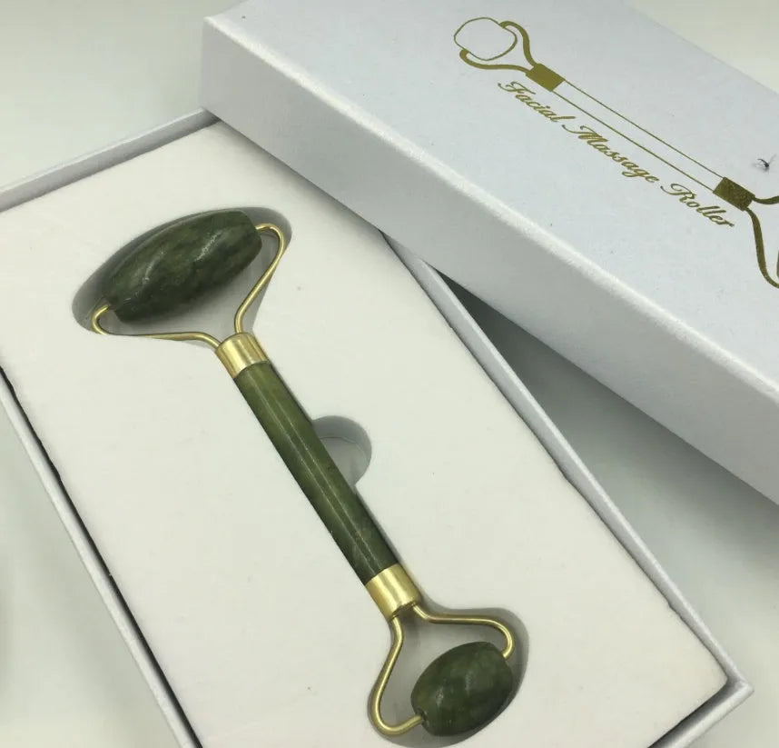 Xiuyu jade double-headed facial massage roller stick on white background