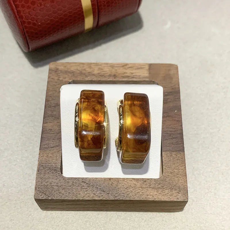 Simple Retro amber resin drop dangle earrings Style1, lightweight, approx 3.5 cm length, warm translucent colour, on neutral background
