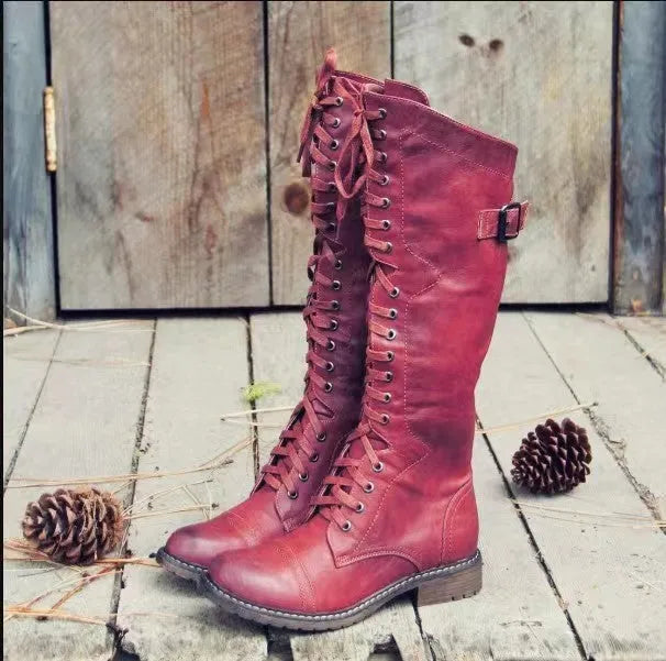 Black chunky heel high-leg casual boot with round toe and low rubber sole on a plain background.